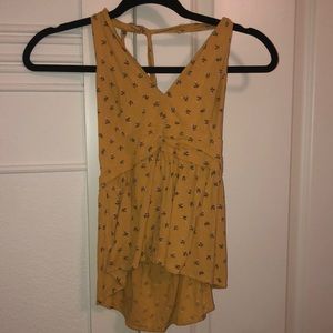 A flowery shirt that wraps around your neck from American Eagle. Size Small.